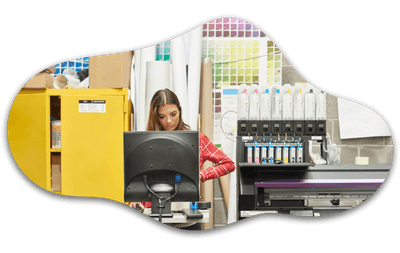 decorative image of print operator and digital printer in studio