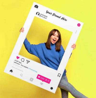 woman posing with custom printed selfie frame for events